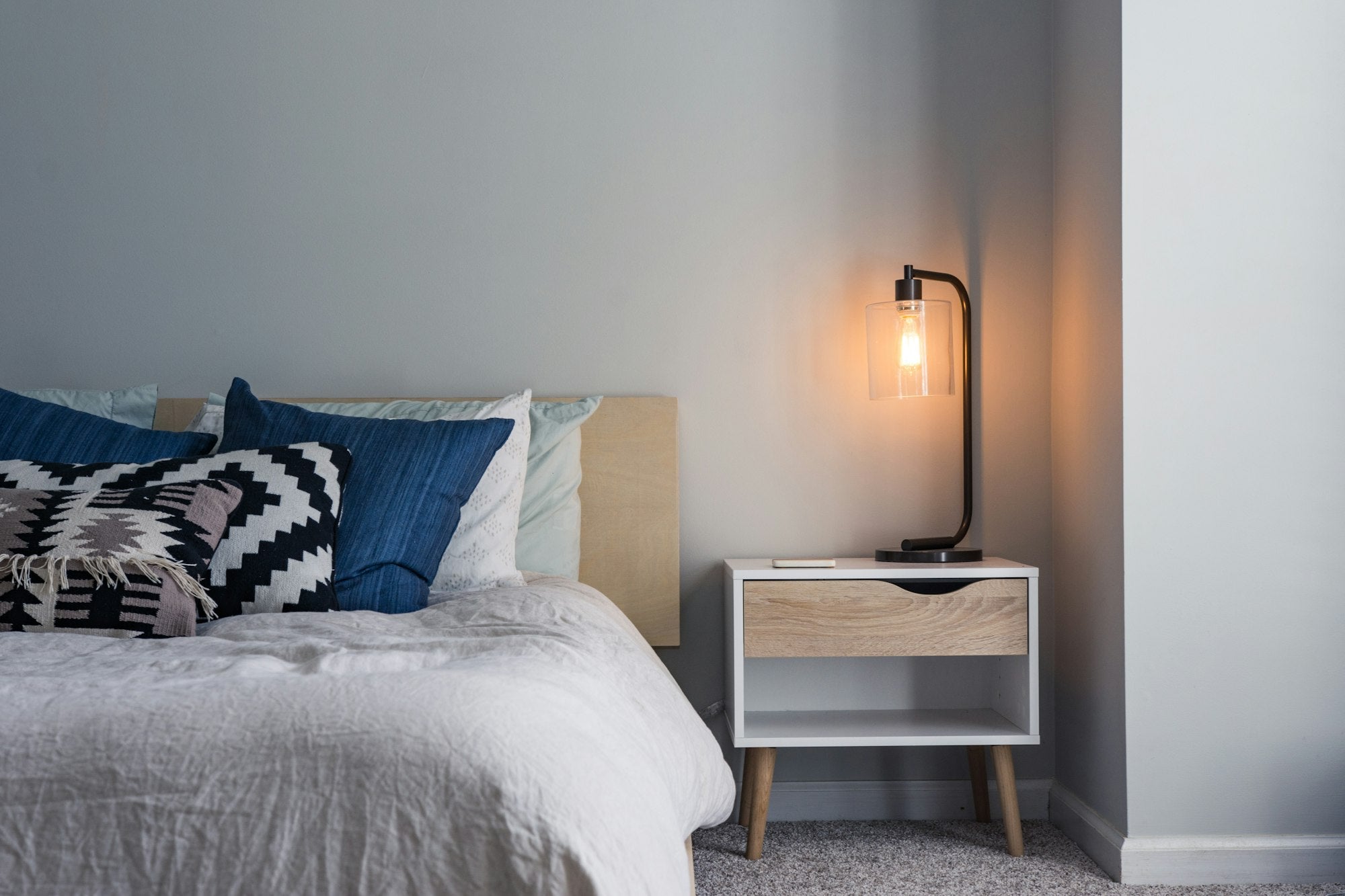 Mira wingback upholstered bed in a bright bedroom
